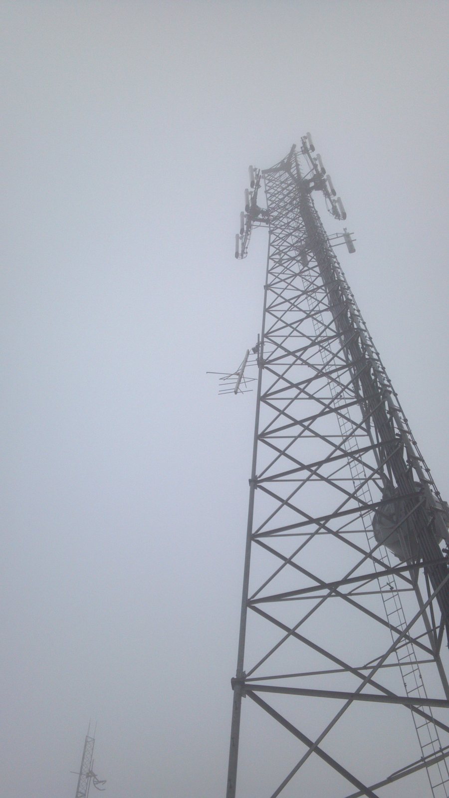 The original Otter Rock communications tower in coastal fog before its replacement