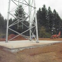 Base of the new 200-foot tower on its square concrete mat foundation