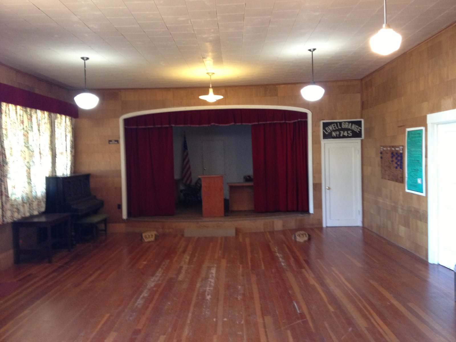 Main meeting hall and stage inside the 1940 Lowell Grange in Lowell, Oregon