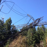 Tangled tower sections and cables suspended in guy wires after the 2013 tower collapse
