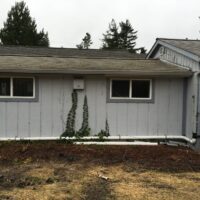 Existing single-story office building on the site before the project