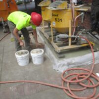 Grout plant set up outside the building for the micropile work